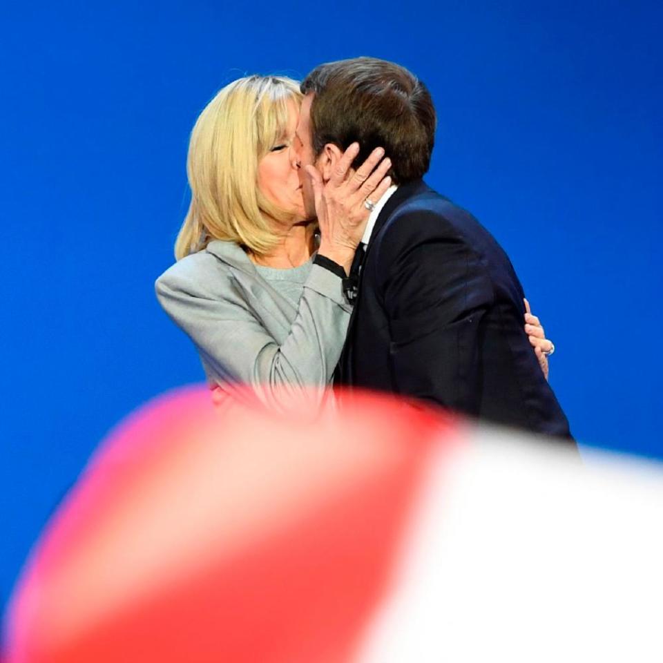 Emmanuel Macron embraces his wife Brigitte after the first round of the presidential elections.