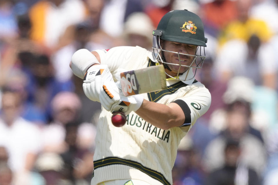 Australia's David Warner plays a shot but gloves the ball as he is caught out by India's Srikar Bharat off the bowling of India's Shardul Thakur on the first day of the ICC World Test Championship Final between India and Australia at The Oval cricket ground in London, Wednesday, June 7, 2023. (AP Photo/Kirsty Wigglesworth)