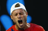 Australia's Lleyton Hewitt reacts during his second round match against Spain's David Ferrer at the Australian Open tennis tournament at Melbourne Park, Australia, January 21, 2016. REUTERS/Thomas Peter