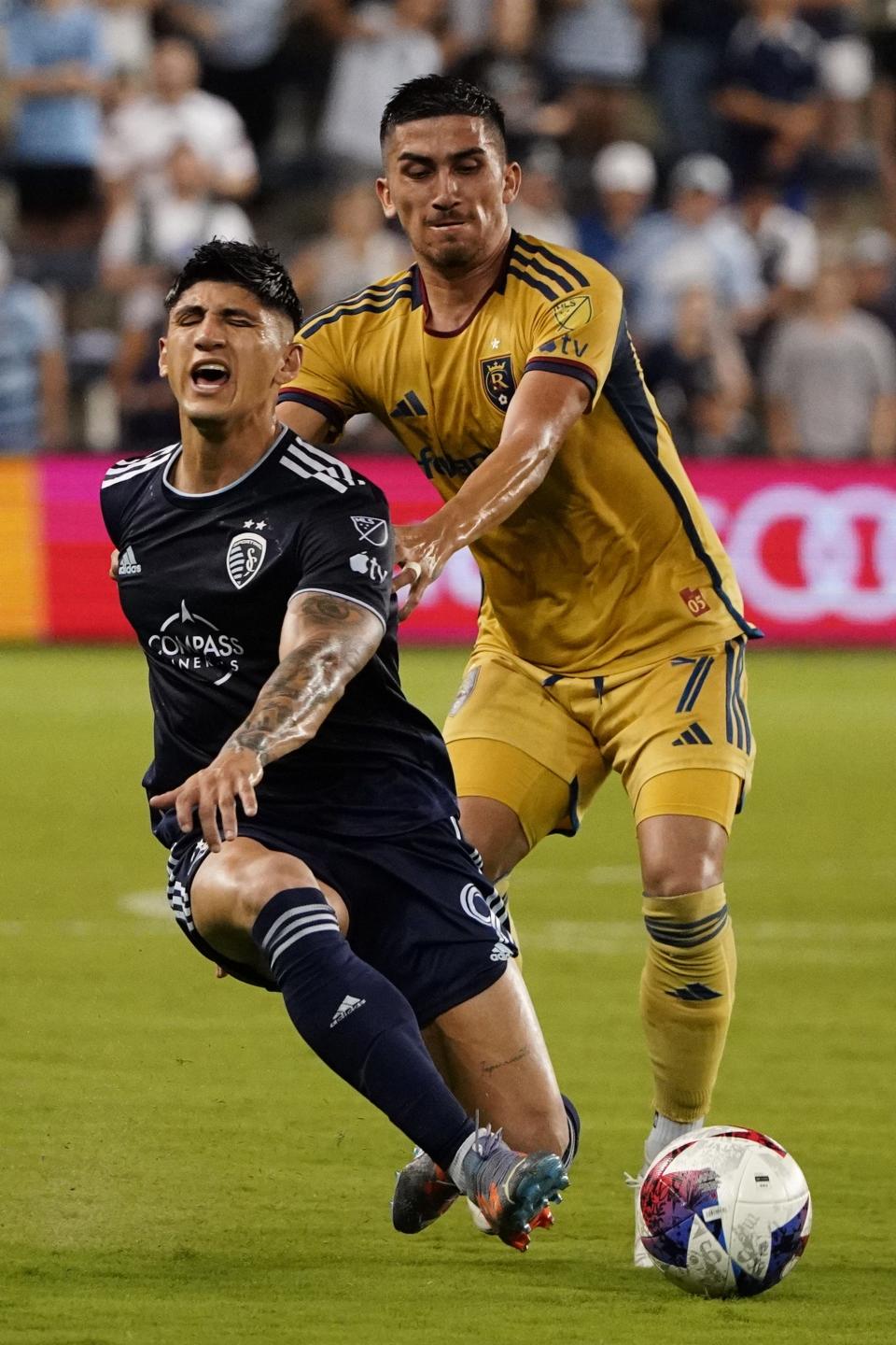Real Salt Lake's Pablo Ruiz (7) and Sporting Kansas City's Alan Pulido fight for the ball during the second half on July 12. Pulido leads SKC with 10 goals and three assists.