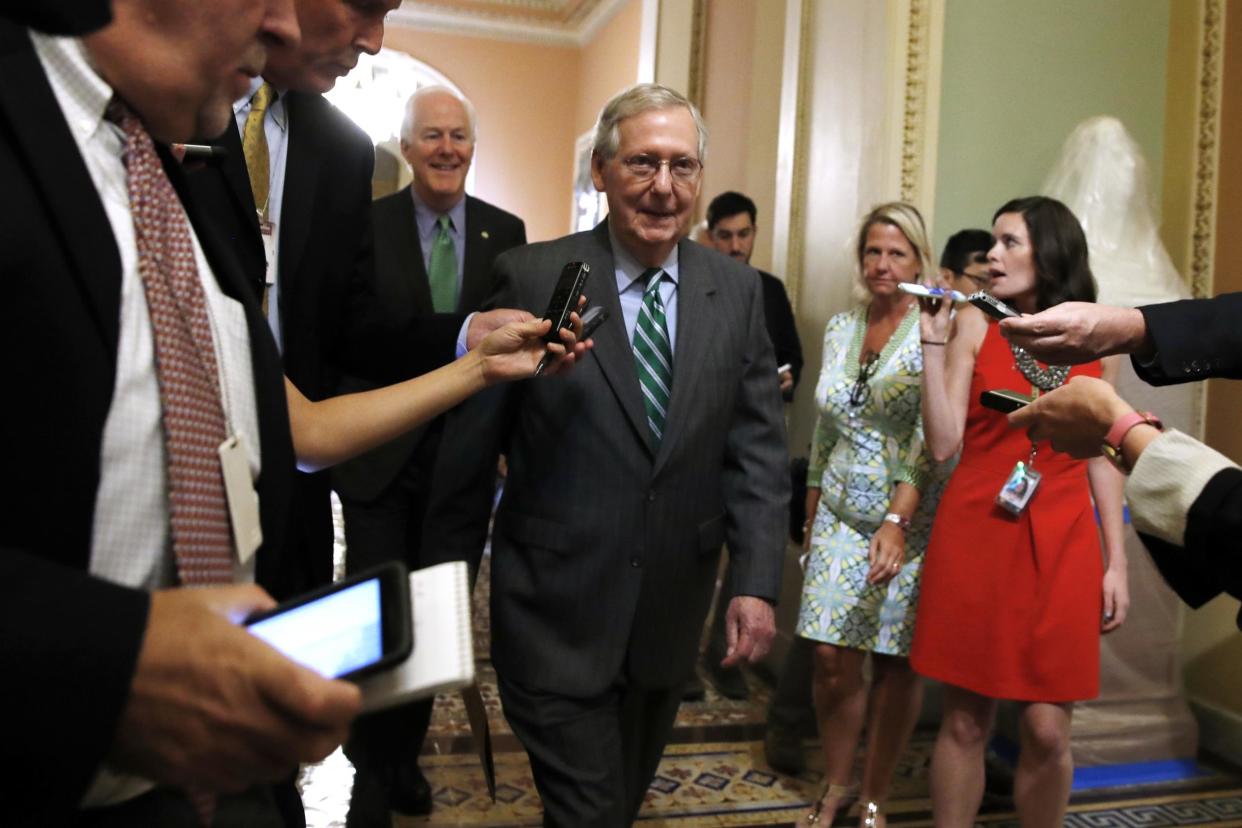 Senate Majority Leader Mitch McConnell, followed by Majority Whip John Cornyn: AP