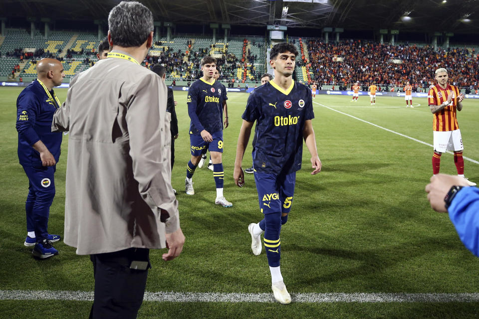 Fenerbahce's players withdrew from the pitch after Galatasaray's first goal during Turkey Super Cup Final soccer match in Sanliurfa, Turkey, Sunday, April 7, 2024. (Huseyin Yavuz/Dia Images via AP)