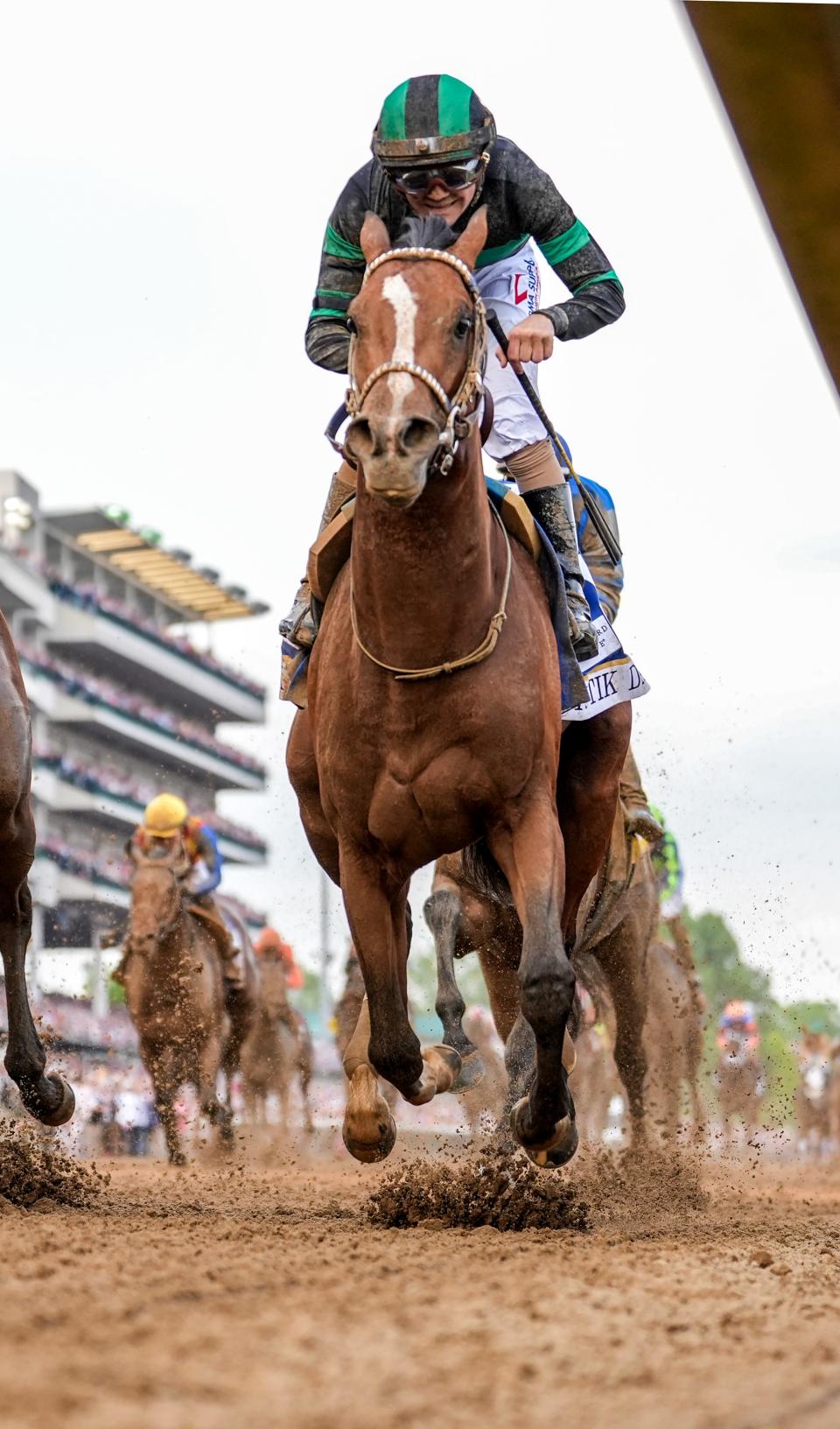 Mystik Dan, right, wins the Kentucky Derby in a photo finish on Saturday, May 4, 2024.