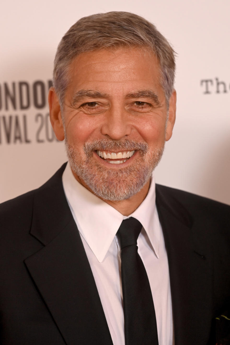 George Clooney laughing at an event