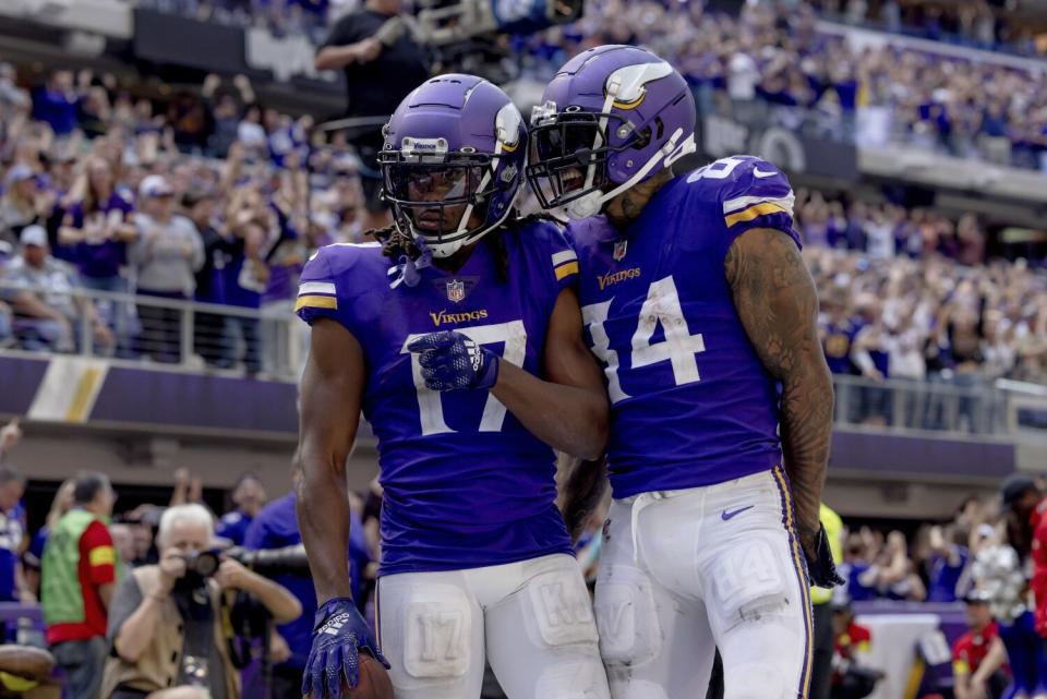 Minnesota Vikings tight end Irv Smith Jr. celebrates with wide receiver K.J. Osborn.