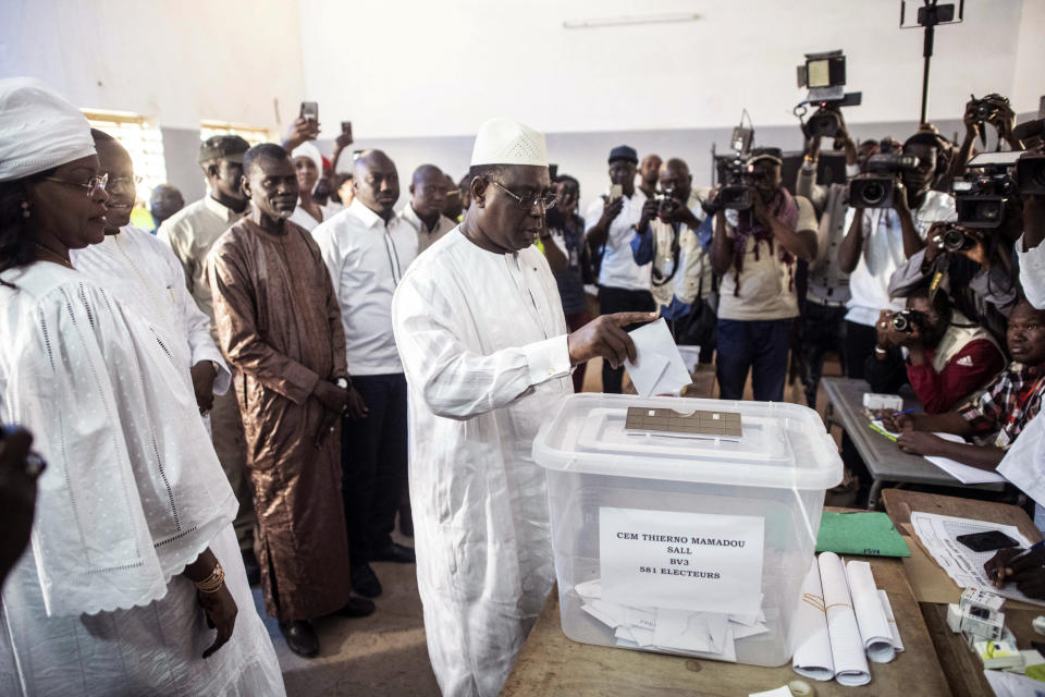 Senegal's incumbent President Macky Sall casts his vote during the presidential election at a polling station in Fatick, Senegal, Sunday Feb. 24, 2019. Senegalese voters are choosing Sunday whether to give President Macky Sall a second term in office as critics accused the incumbent leader of having blocked the strongest opposition candidates from running against him. (AP Photo)