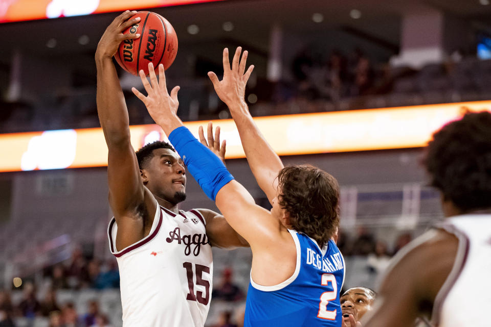 Texas A&M forward Henry Coleman III (15) shoots over Boise State forward Tyson Degenhart (2) during the first half of an NCAA college basketball game in Fort Worth, Texas, Saturday, Dec. 3, 2022. (AP Photo/Emil Lippe)