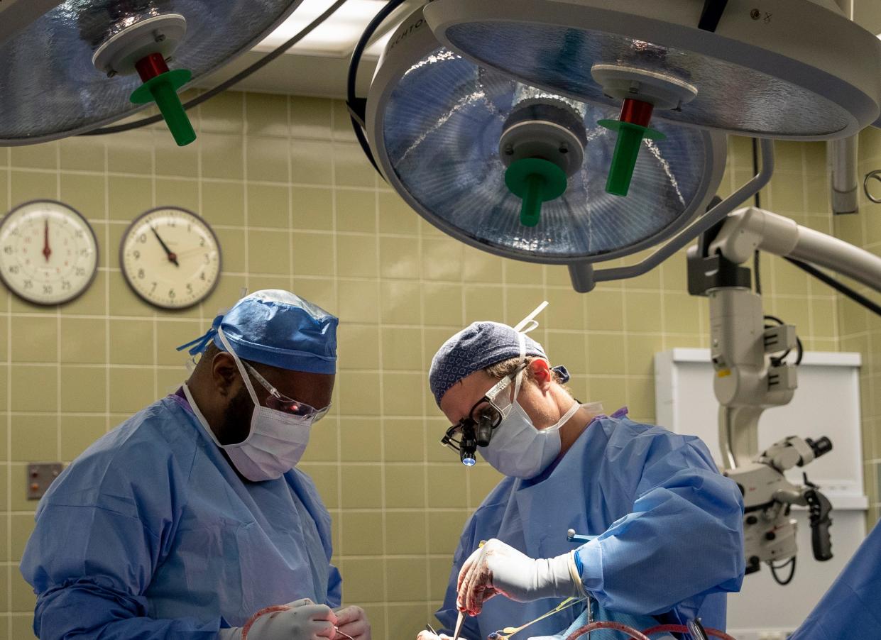 Kendrick Whitehead, certified surgical first assistant at Saint Francis Hospital-Memphis, left, and Dr. Andy Boucher, a neurosurgeon with Semmes Murphey Clinic, right, perform a craniotomy in preparation for the placement of a GammaTile on Wednesday, Aug. 3, 2022, at Saint Francis Hospital-Memphis. Surgeons first remove the brain tumors and then fill the remaining space with the GammaTile — a device that delivers targeted radiation therapy.