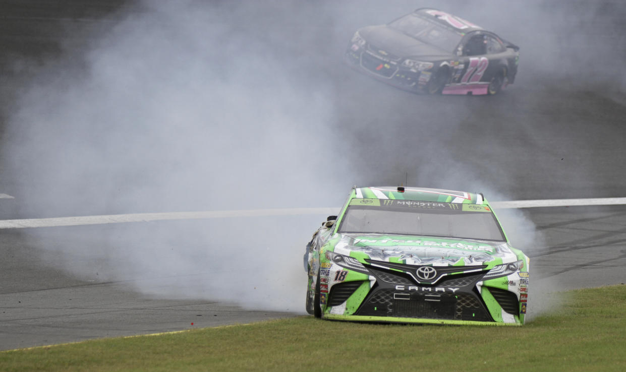 Kyle Busch spins in Turn 2 during a NASCAR Cup Series auto race at Charlotte Motor Speedway in Concord, N.C., Sunday, Oct. 8, 2017. (AP Photo/Amanda Newman)