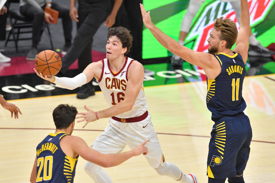 CLEVELAND, OHIO - DECEMBER 12: Cedi Osman #16 of the Cleveland Cavaliers shoots over Domantas Sabonis #11 of the Indiana Pacers during the first half of a preseason game at Rocket Mortgage Fieldhouse on December 12, 2020 in Cleveland, Ohio. NOTE TO USER: User expressly acknowledges and agrees that, by downloading and/or using this Photograph, user is consenting to the terms and conditions of the Getty Images License Agreement. (
