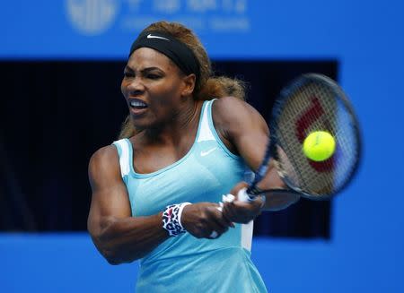 Serena Williams of the U.S. returns the ball during her women's singles match against Silvia Soler-Espinosa of Spain at the China Open tennis tournament in Beijing September 29, 2014. REUTERS/Petar Kujundzic