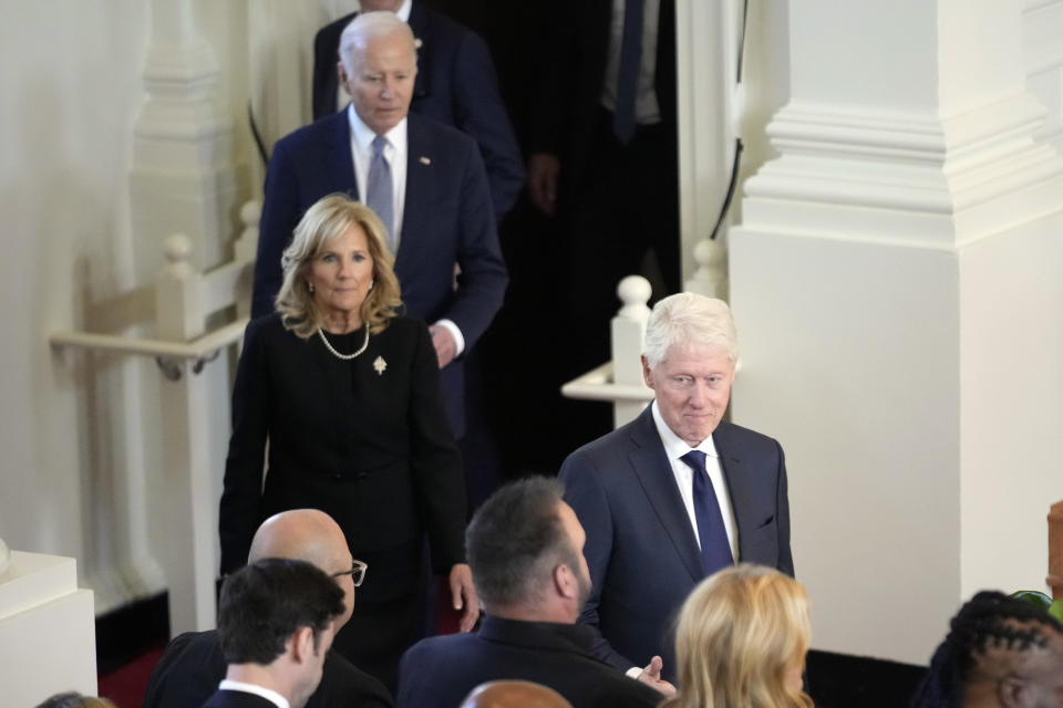 President Joe Biden, first lady Jill Biden and former President Bill Clinton, arrive for a tribute service for former first lady Rosalynn Carter, at the Glenn Memorial Church, in Atlanta, Tuesday, Nov. 28, 2023. (AP Photo/Andrew Harnik)