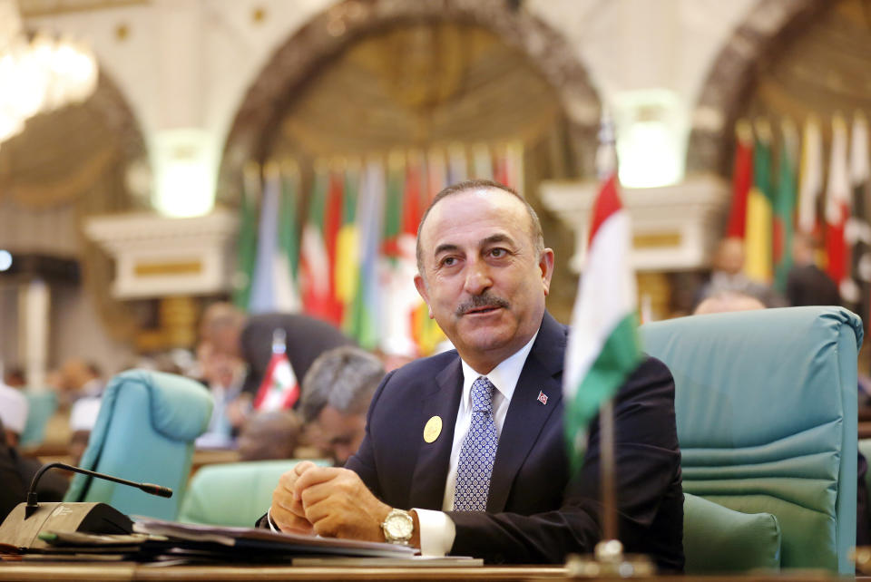 Turkey's Foreign Minister Mevlut Cavusoglu attends Islamic Summit of the Organization of Islamic Cooperation (OIC) in Mecca, Saudi Arabia, early Saturday, June 1, 2019. Muslim leaders from some 57 nations gathered in Islam's holiest city of Mecca late Friday to discuss a breadth of critical issues ranging from a spike in tensions in the Persian Gulf, to Palestinian statehood, the plight of Rohingya refugees and the growing threat of Islamophobia. (AP Photo/Amr Nabil)