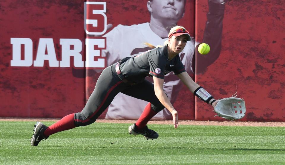 Alabama left fielder Jenna Johnson dives and makes a catch on a sinking line drive during the game with Texas in Rhoads Stadium Saturday, March 5, 2022, in the Crimson Classic. 
