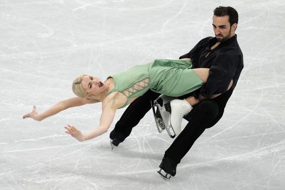 Olivia Smart and Adrian Diaz, of Spain, perform their routine in the ice dance competition during the figure skating at the 2022 Winter Olympics, Monday, Feb. 14, 2022, in Beijing. (AP Photo/Natacha Pisarenko)