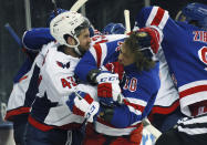 Washington Capitals' Tom Wilson (43) takes a roughing penalty during the second period against New York Rangers' Artemi Panarin (10) in an NHL hockey game Monday, May 3, 2021, in New York. (Bruce Bennett/Pool Photo via AP)