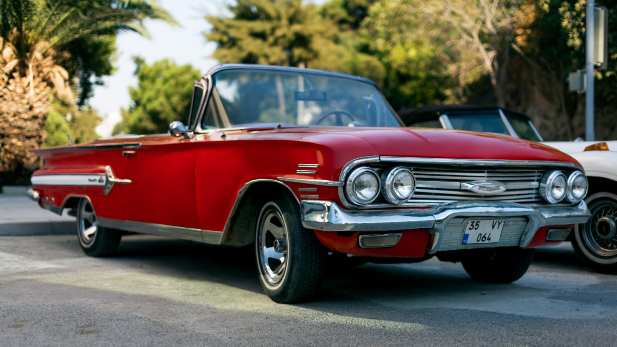 Izmir, Turkey - September 23, 2018: Front view of a red colored 1960 Chevrolet Impala.