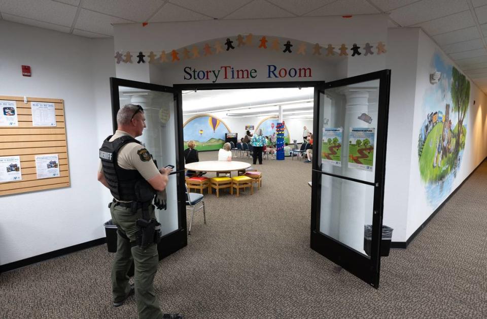 A Sheriff’s deputy stands outside the story time room during Rainbow Story Time at the Stanislaus County Library in Salida, Calif., Thursday, June 15, 2023. Andy Alfaro/aalfaro@modbee.com