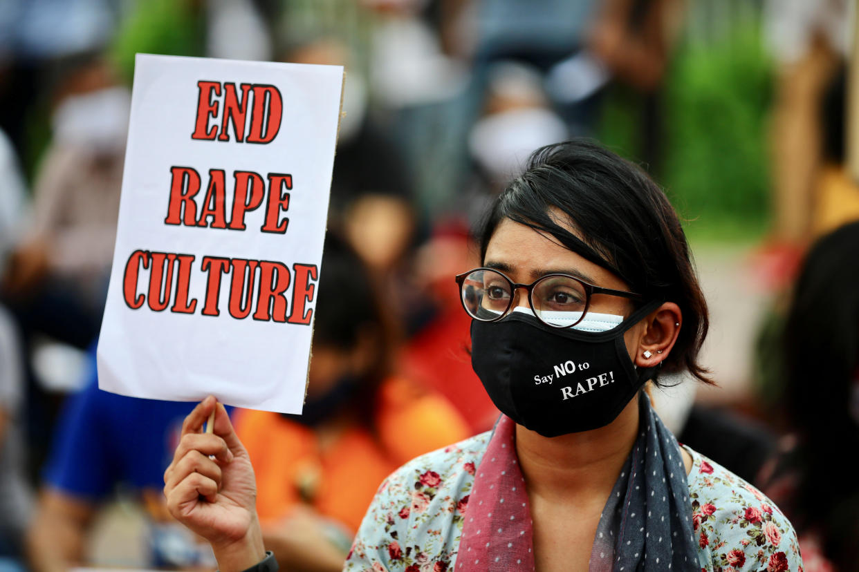 Members of a feminist group take part in an ongoing protest in front of the parliamentary building, demanding justice for the alleged gang rape of a woman in Noakhali, Bangladesh, in Dhaka, October 10, 2020. / Credit: MOHAMMAD PONIR HOSSAIN/REUTERS