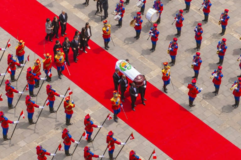 The coffin of former president Alberto Fujimori receives state honors in front of the Presidential Palace in Lima on September 14, 2024 (ANDRES VALLE)