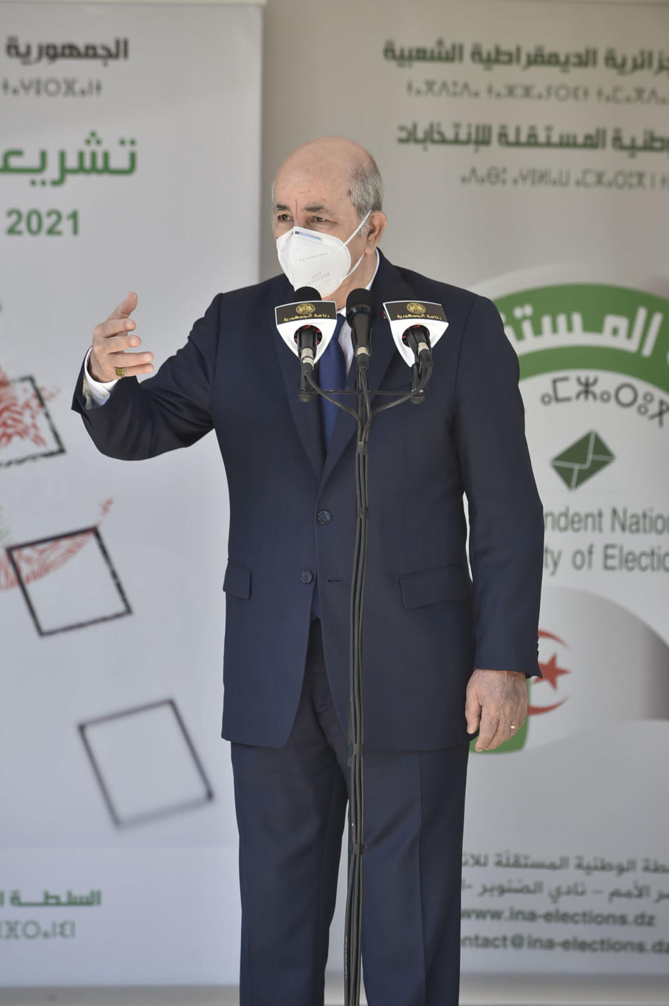 Algerian president Abdelmadjid Tebboune speaks to the press after casting his vote in the country's first legislative elections sine the ouster of ex-president Bouteflika, at the Ahmed Ouroua school, in Algiers, Algeria, Saturday, June 12, 2021. Algerians vote Saturday for a new parliament in an election with a majority of novice independent candidates running under new rules meant to satisfy demands of pro-democracy protesters and open the way to a "new Algeria." (AP Photo)