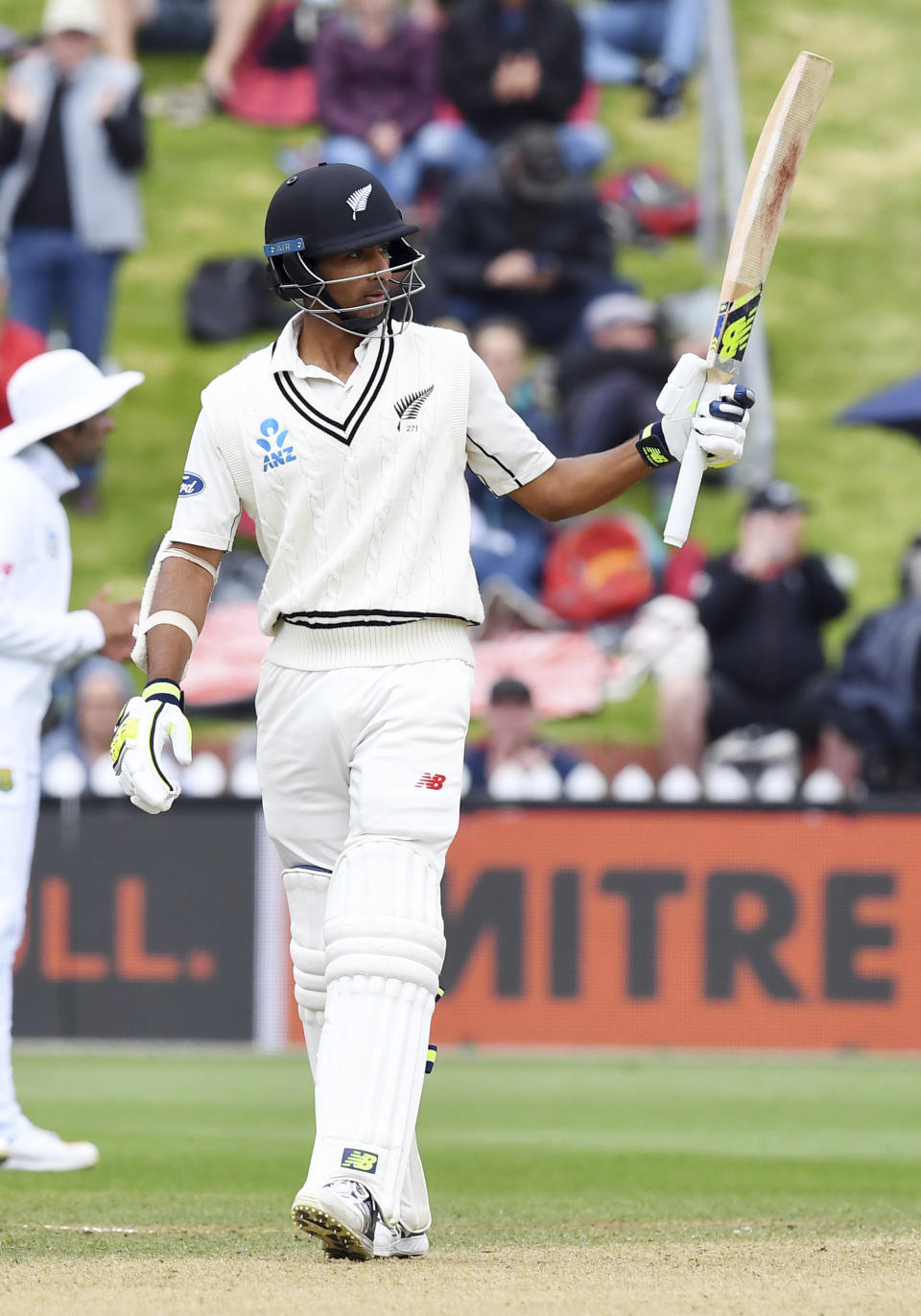 New Zealand's Jeet Raval signals his second test 50, against South Africa during the second cricket test at the Basin Reserve in Wellington, New Zealand, Saturday, March 18, 2017. (Ross Setford/SNPA via AP)