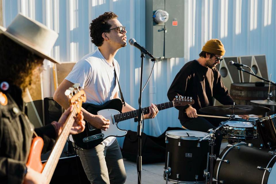 Wilmington musician Carlos Rising (center) and his band, Holy Heat, performing at The Starling Bar.