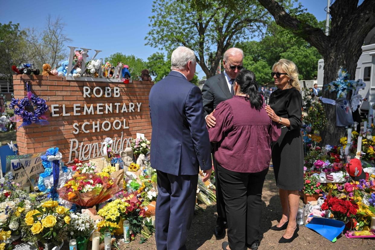 US President Joe Biden and First Lady Jill Biden greet Mandy Gutierrez, the Priciple of Robb Elementary School, as he and First Lady Jill Biden pay their in Uvalde, Texas on May 29, 2022. - Biden is heading to Uvalde, Texas to pay his respects following a school shooting. (Photo by MANDEL NGAN / AFP) (Photo by MANDEL NGAN/AFP via Getty Images)