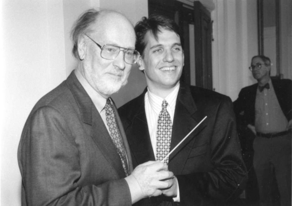 Boston Pops Laureate Conductor John Williams hands the baton to Keith Lockhart in 1995.