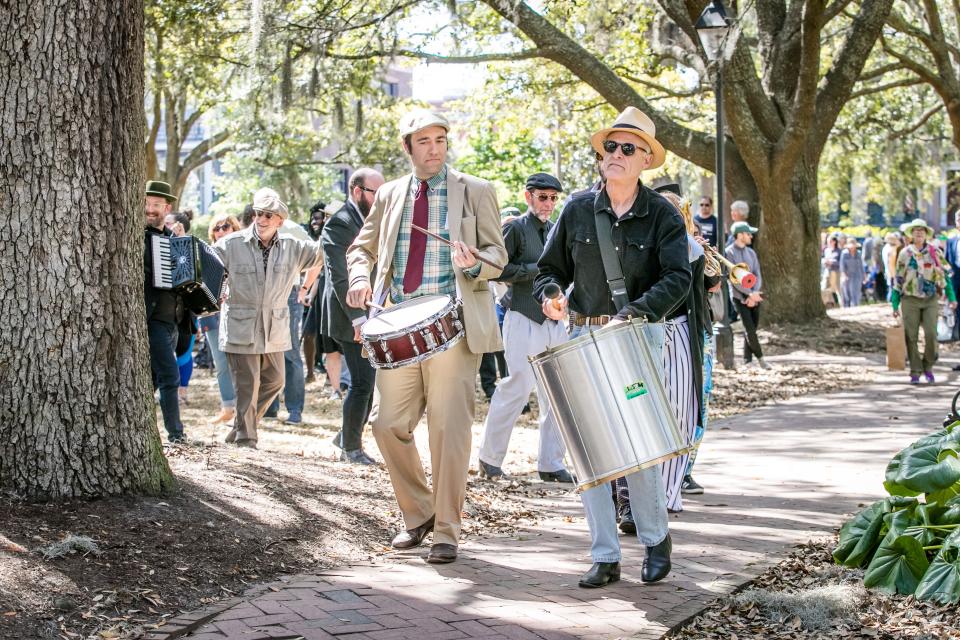 Savannah's Sweet Thunder Strolling Band performed several songs and then led a short parade in and around Lafayette Square during the Sunday birthday celebration honoring Flannery O'Connor.