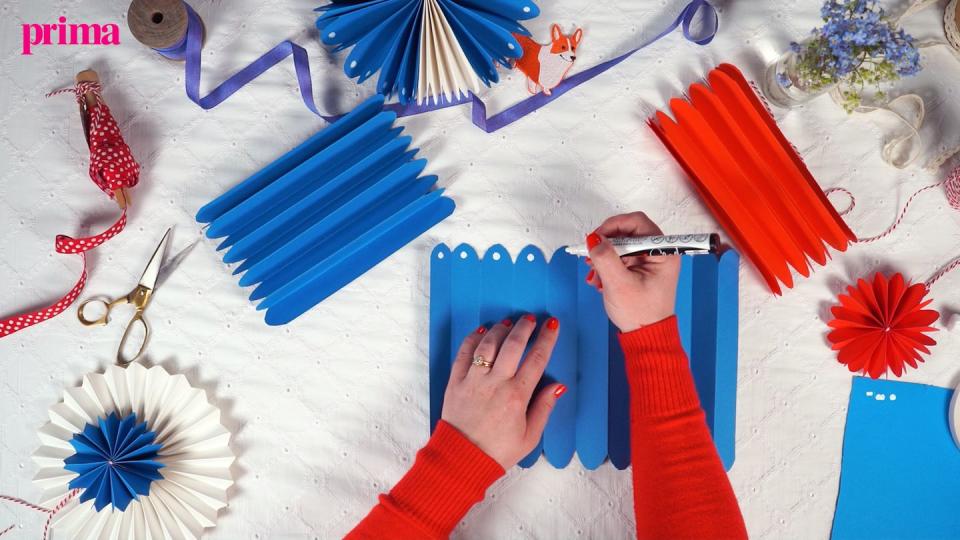 decorating paper fans with chalk pen