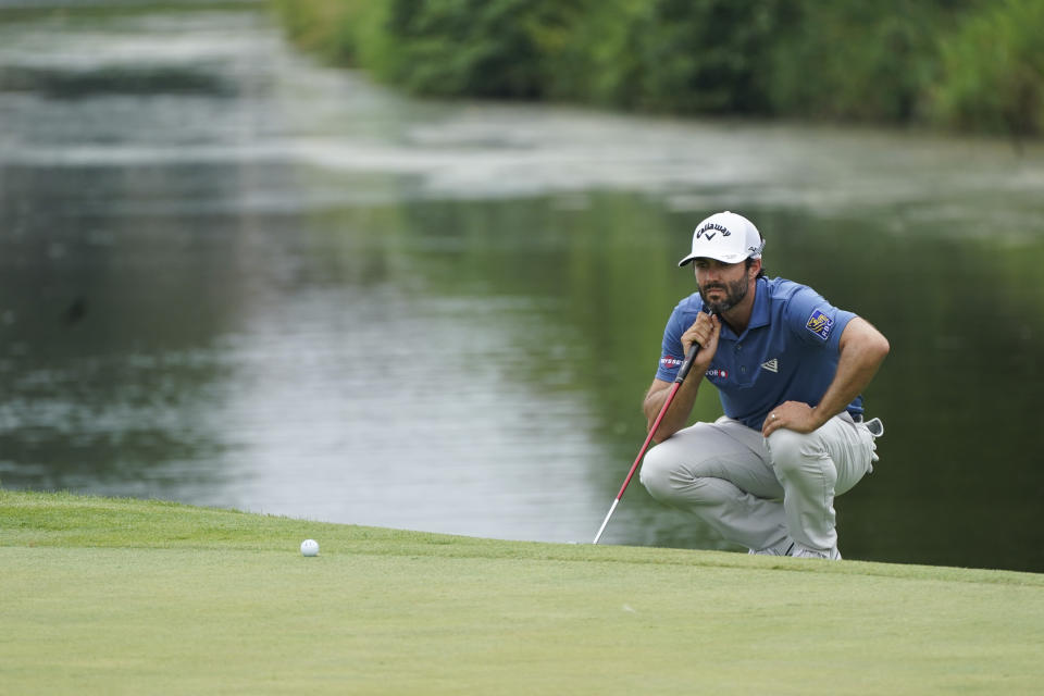 Adam Hadwin lines up a shot on the sixth hole during the second round of the 3M Open golf tournament in Blaine, Minn., Friday, July 23, 2021. (AP Photo/Craig Lassig)