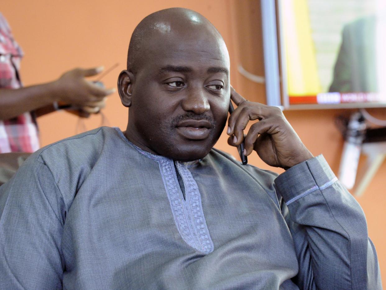 Liberia FA chairman Musa Bility  speaks on his mobile phone on June 19, 2015, after annoucing plans to stand for the presidency of Fifa, in the Liberian capital Monrovia.  AFP PHOTO / ZOOM DOSSO        (Photo credit should read ZOOM DOSSO/AFP/Getty Images)