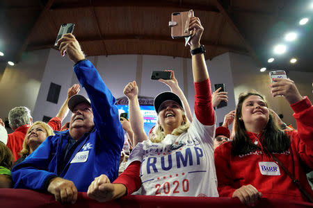 Supporters cheer as U.S. President Donald Trump arrives to speak during a Make America Great Again rally in Richmond, Kentucky, U.S., October 13, 2018. REUTERS/Joshua Roberts