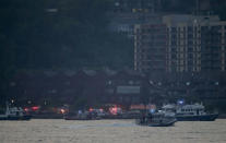 <p>Search and rescue boats look for a small plane that went down in the Hudson River, Friday, May 27, 2016. A World War II vintage P-47 Thunderbolt aircraft crashed into the river Friday, May 27 killing its pilot. (AP Photo/Julie Jacobson) </p>