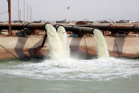 Water pours in Al Bida water tanks project in Basra, Iraq September 12, 2018. REUTERS/Alaa al-Marjani/Files