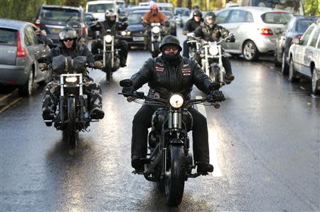 Members of the Hell's Angels motorcycle club arrive for the funeral of Ronnie Biggs in north London January 3, 2014. REUTERS/Neil Hall