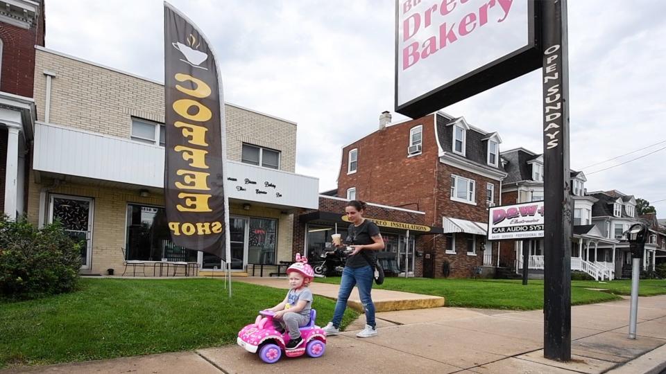 Jessica Green, right, and her daughter Kennedy, regulars at Buttercream Dream Bakery in West York, drive and walk away with their treats in 2021.