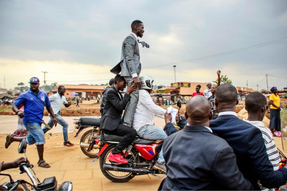 Bobi Wine on Boda boda escaping from Police in Uganda Kampala