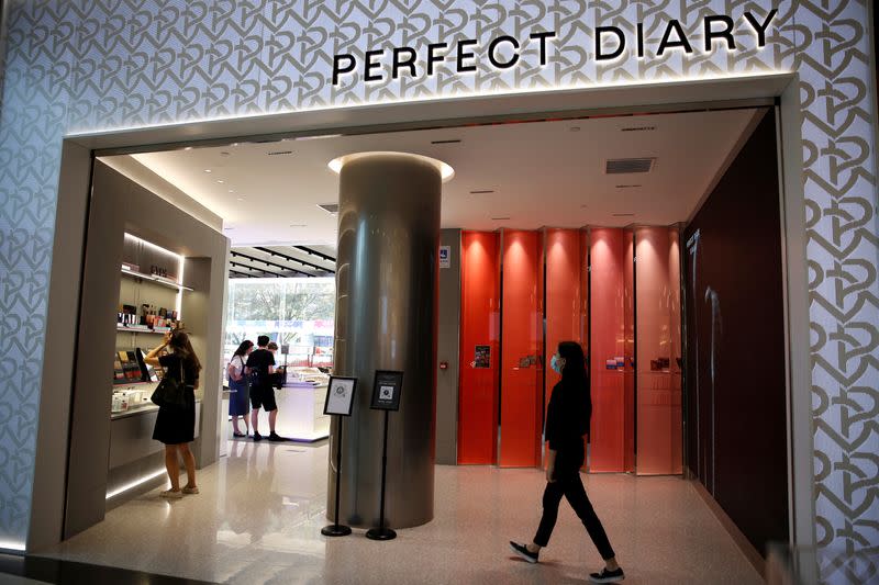 People are seen at a Chinese cosmetics brand Perfect Diary store, in Beijing