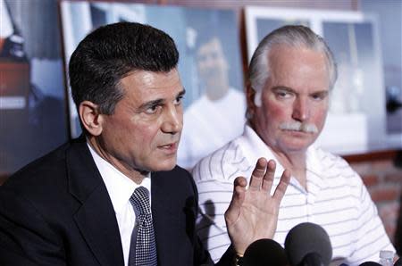 Garo Mardirossian, attorney for Ron Thomas (R), father of Kelly Thomas, speaks during a news conference in Los Angeles, California January 14, 2014. REUTERS/Alex Gallardo