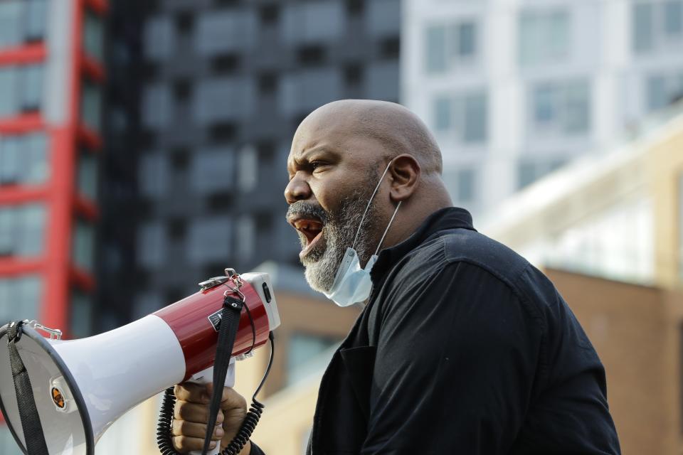 Paster James Roberson leads a prayer with protesters during the Prayerful Protest march for George Floyd, Tuesday, June 2, 2020, in the Brooklyn borough of New York. Floyd died after being restrained by Minneapolis police officers on Memorial Day. (AP Photo/Frank Franklin II)