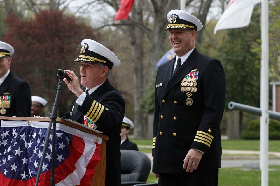 Naval Weapons Station Earle's new Commander Captain Kent "Brewski" Smith (right) laughs as former Commander Captain Edward L. Callahan takes the microphone during the Change of Command ceremony in Colts Neck Friday, April 21, 2023.