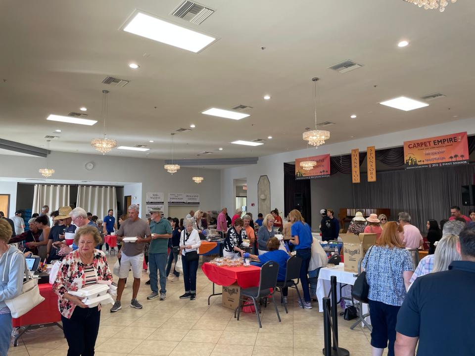 Guests grabbing food at the 14th annual Armenian Cultural Festival on Nov. 12, 2022.  Saint Garabed Armenian Apostolic Church of the Desert's Ladies Auxiliary members prepared most of the dishes.