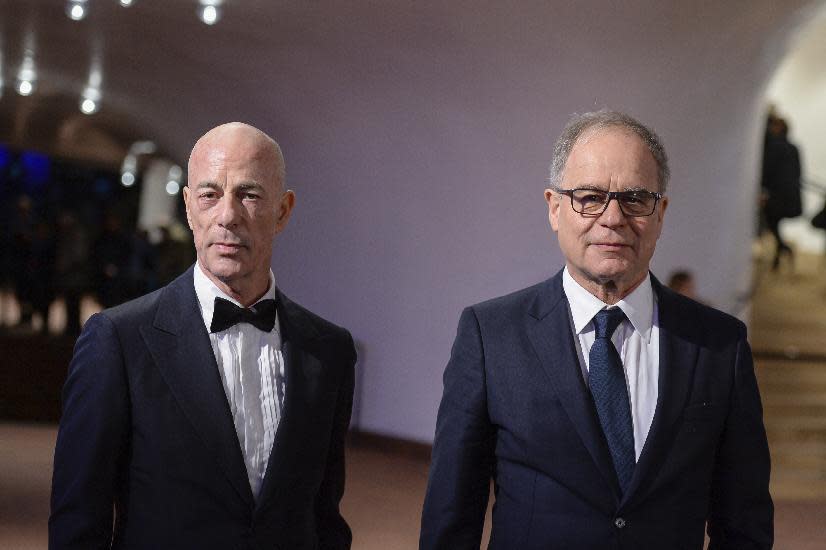 The architects Jacques Herzog, left, and Pierre de Meuron arrive for the inauguration of the Elbphilharmonie concert hall in Hamburg, Germany, Wednesday, Jan. 11, 2017. The concert hall will be inaugurated with a concert and an official ceremony. (Daniel Reinhardt/dpa via AP)