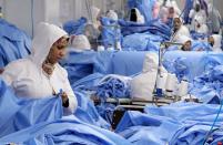 FILE PHOTO: Workers are seen in a factory that produces sterilised surgical equipment and medical clothings in Egypt