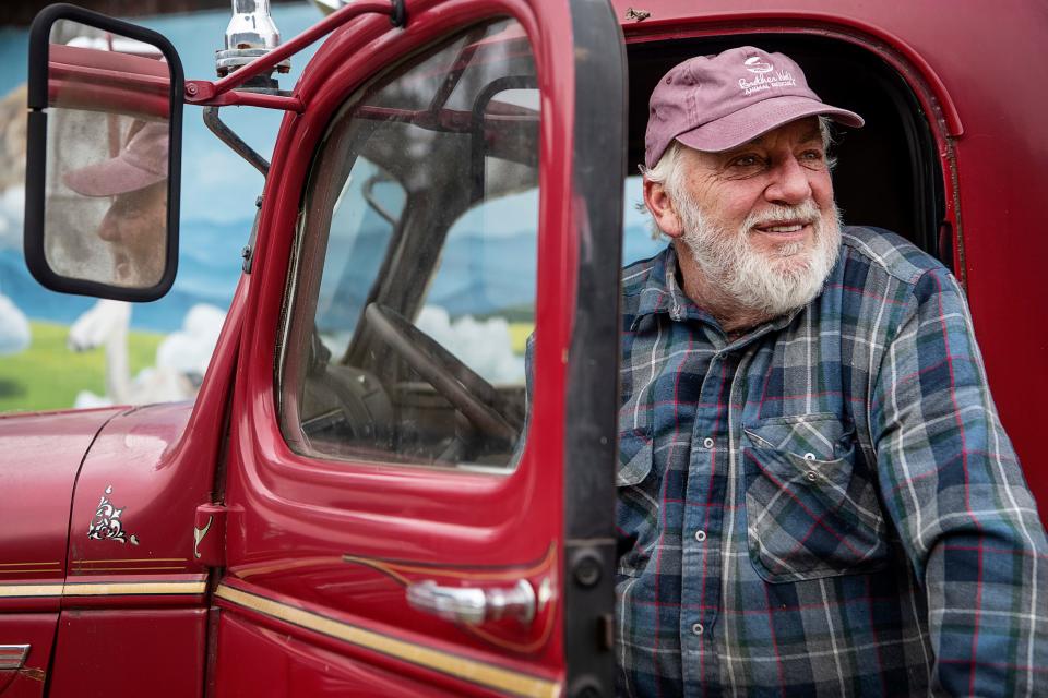 Matt Sperling, owner of the West End Paw Park and Red Truck Cafe and Grill, sits inside his firetruck after sounding its siren December 20, 2022.