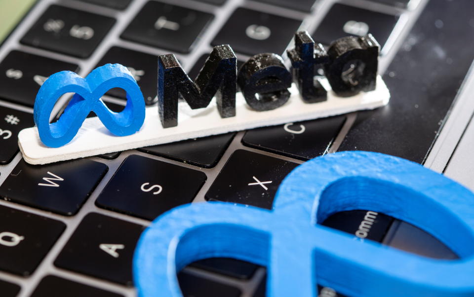 A 3D printed Facebook's new rebrand logo Meta is placed on laptop keyboard in this illustration taken on November 2, 2021. REUTERS/Dado Ruvic/Illustration