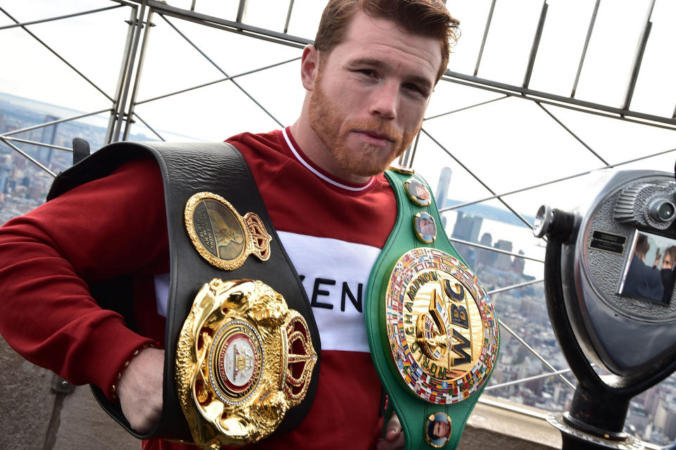 Canelo Alvarez shows off his title belts on Oct. 16, 2018, at the Empire State Building in New York City ahead of his championship match vs. Rocky Fielding at Madison Square Garden on Dec. 15. (Getty Images)
