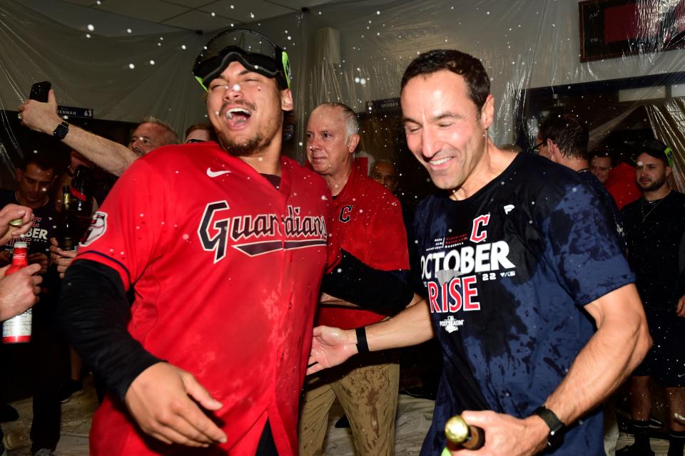 Guardians first baseman Josh Naylor, left, and Chris Antonetti, right, the team's President of Baseball Operations, celebrate in the clubhouse after defeating the Tampa Bay Rays in an AL wild card playoff series, Saturday, Oct. 8, 2022, in Cleveland.